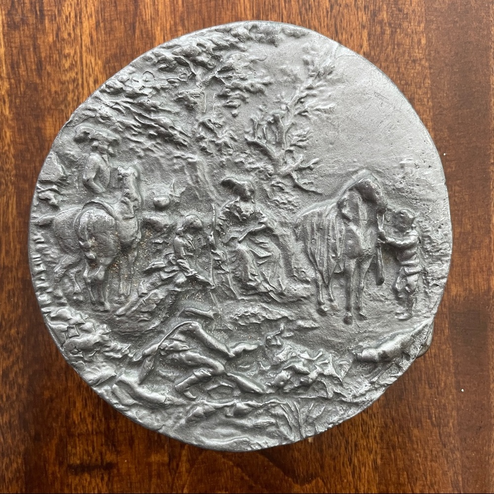 Round metal belt buckle with horses and riders from MM Limited Chicago
